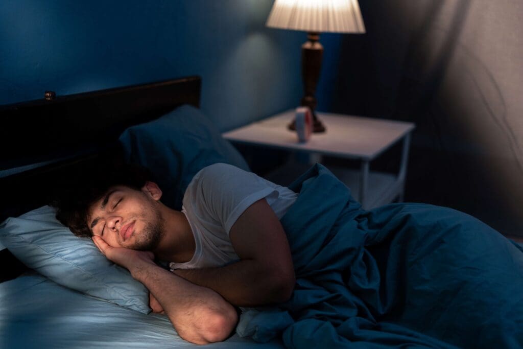 Man sleeping with his head resting on his hand