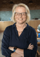 Dr Jen Unwin stood with arms folded