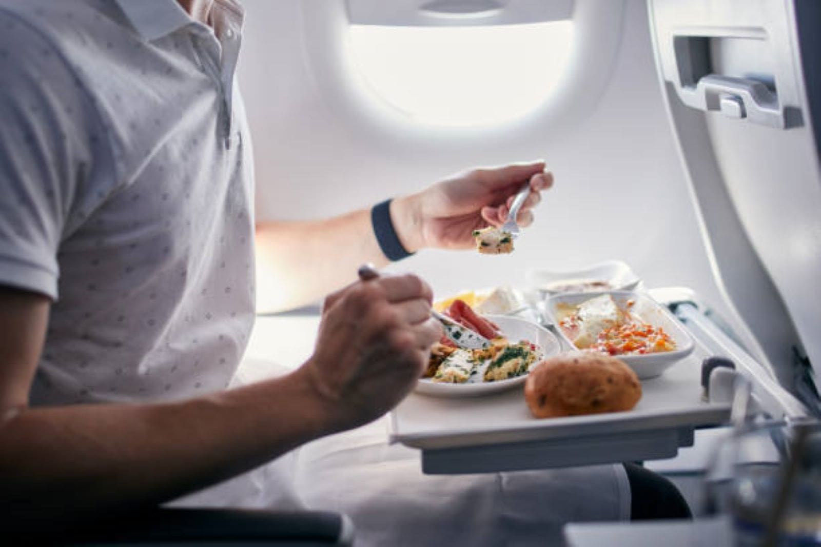 Man eating aeroplane food