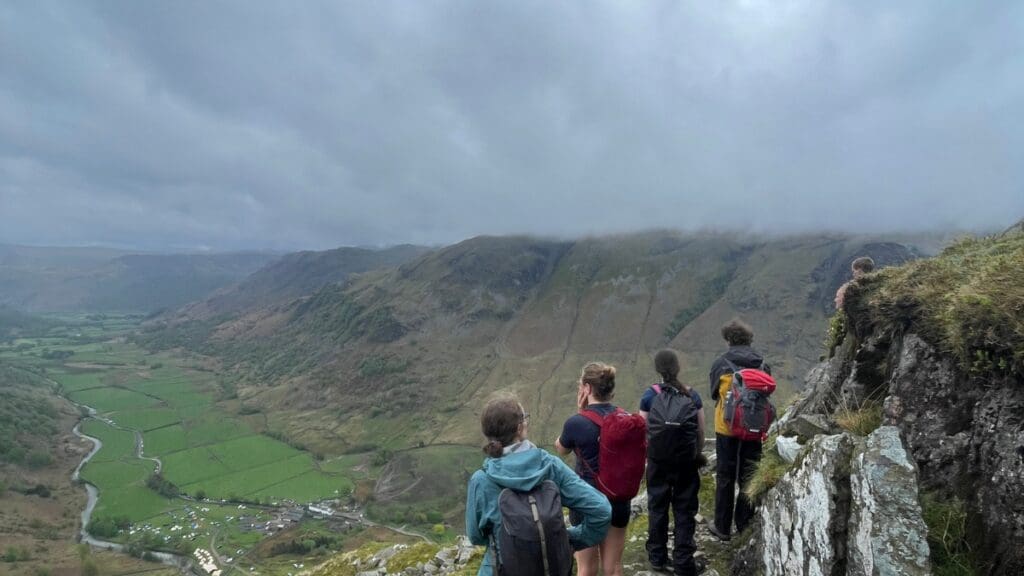 Picture of a group of hikers looking into the valley.