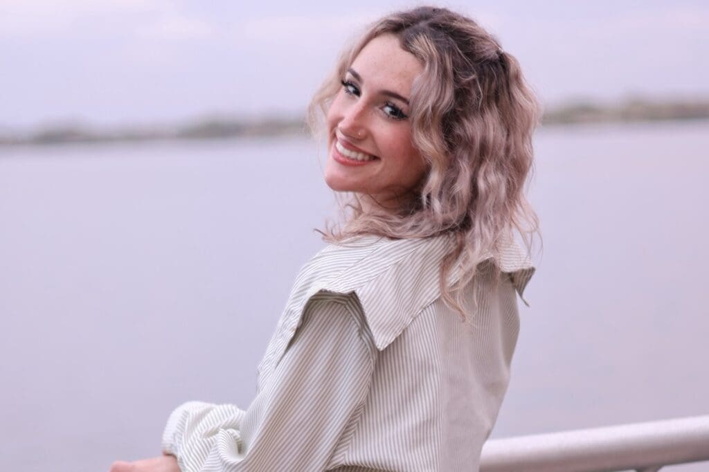 A photo of Allison Zaluski looking out over a body of water